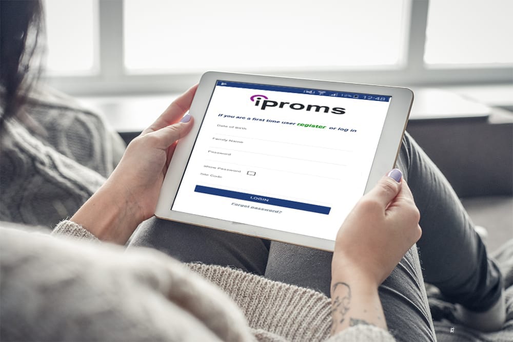 A tablet displaying Cellma's Iproms login screen