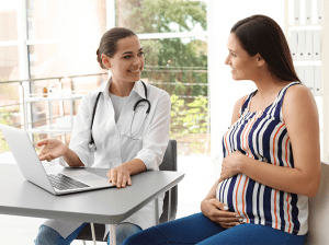 doctor talking to pregnant lady